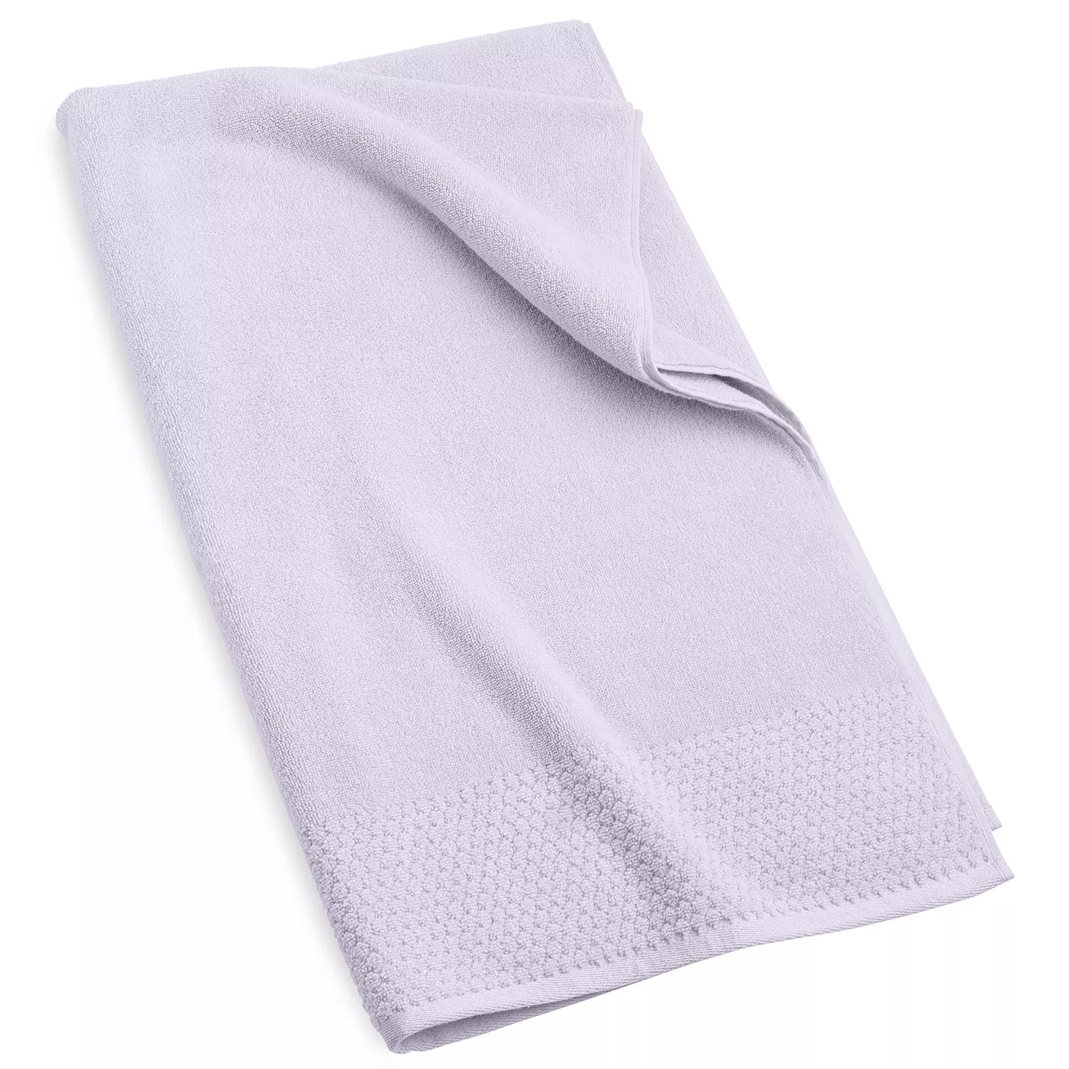 A light purple towel with a textured border, partially folded.