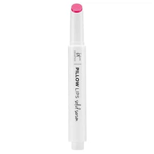 It Cosmetics Pillow Lips Solid Serum features a sleek white tube with pink lip color. It's designed to provide a moisturizing lip treatment with a hint of color.
