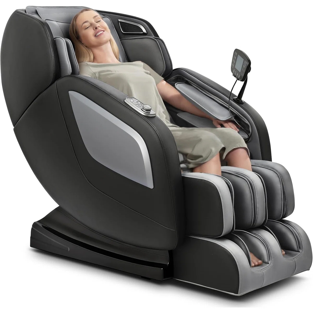 A massage chair with a person reclining in it, featuring multiple padded sections and a control panel on the armrest.