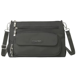 A dark gray Baggallini crossbody bag with multiple zippered compartments and an adjustable strap.