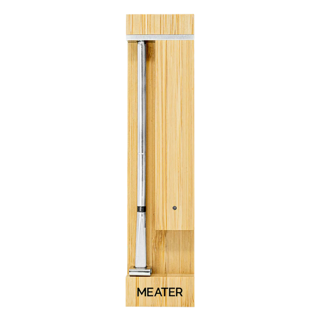 Wooden thermometer holder with a digital meat probe labeled \“MEATER.\“