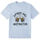 A light blue T-shirt features the text \“APRES SKI INSTRUCTOR\“ with an image of two clinking beer mugs, surrounded by snowflakes.