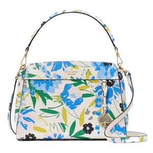 Kate Spade floral print satchel with blue and green flowers on a white background, featuring a top handle, detachable shoulder strap, and gold-tone hardware with spade charm.