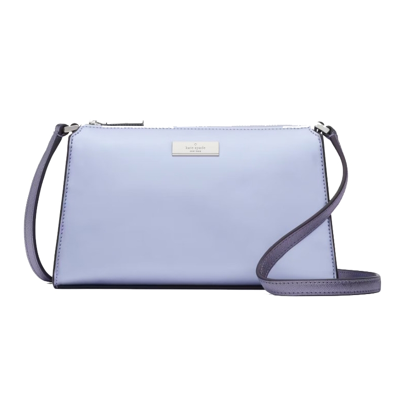A light blue Kate Spade Kenzie Mini Crossbody bag with a long, adjustable strap, and the brand's logo on a metallic plate.