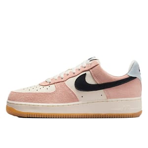 Nike Women's Air Force 1 '07 features a pink suede and cream leather upper with a black Swoosh, light grey heel tab, and a gum sole.