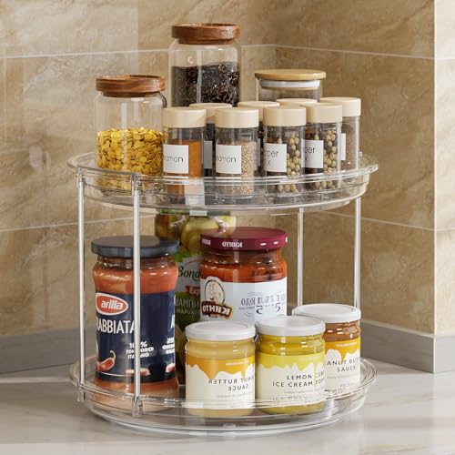 A two-tiered lazy Susan holds jars of spices and condiments, including pasta sauce, honey, and various labeled spices.