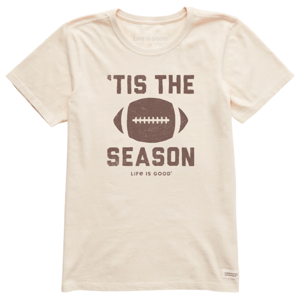 Off-white T-shirt with the text \“'Tis the Season\“ and a football graphic. The phrase \“Life is Good\“ is printed below the design.
