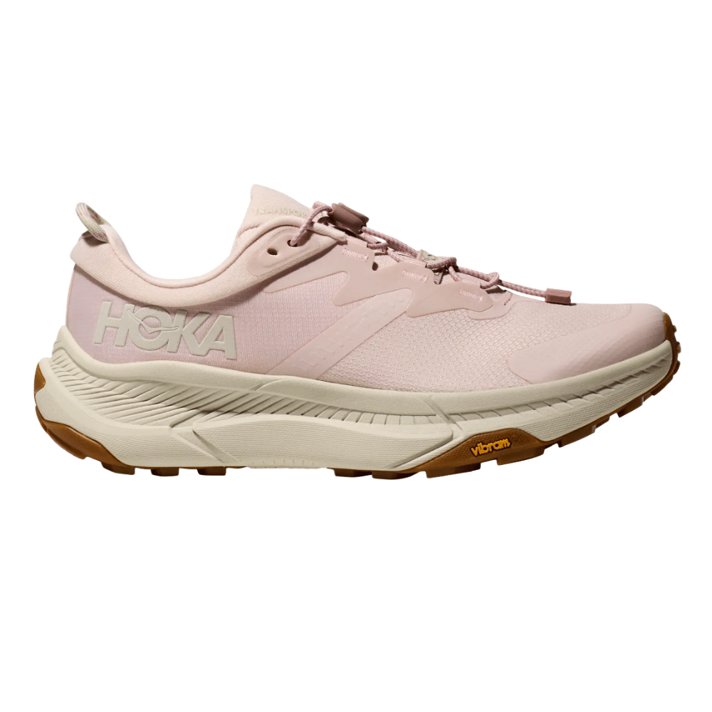 Light pink HOKA running shoe with a Vibram sole, featuring a cushioned midsole and lace-up closure.