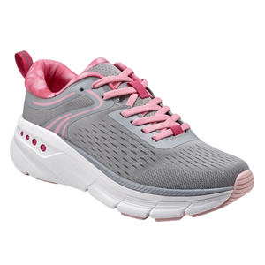 A gray and pink athletic shoe with a breathable mesh upper, pink laces, and a white cushioned sole featuring pink accents.