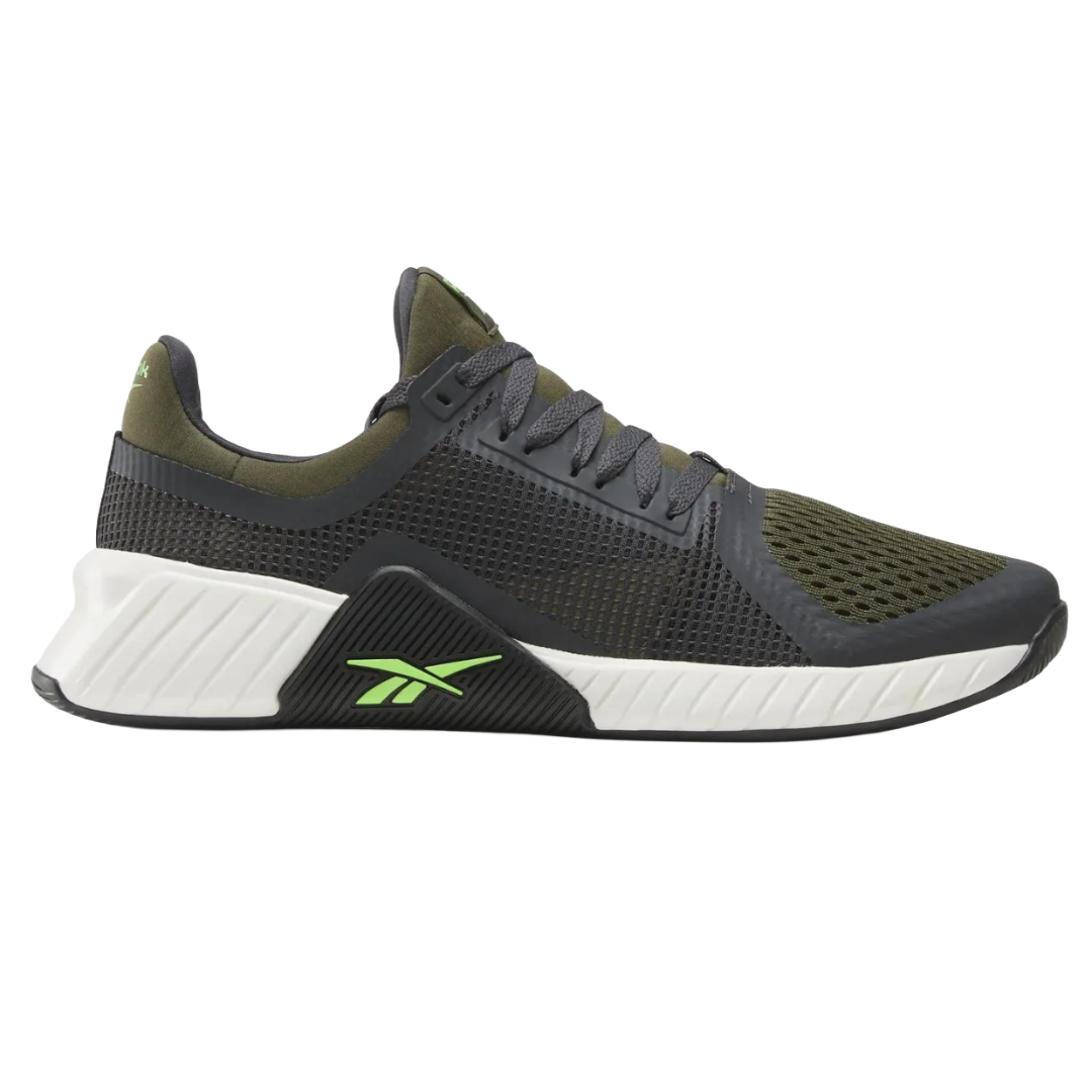 A sneaker featuring a black and olive color scheme with a mesh upper, reinforced heel, and a white and black textured sole featuring green logo accents.