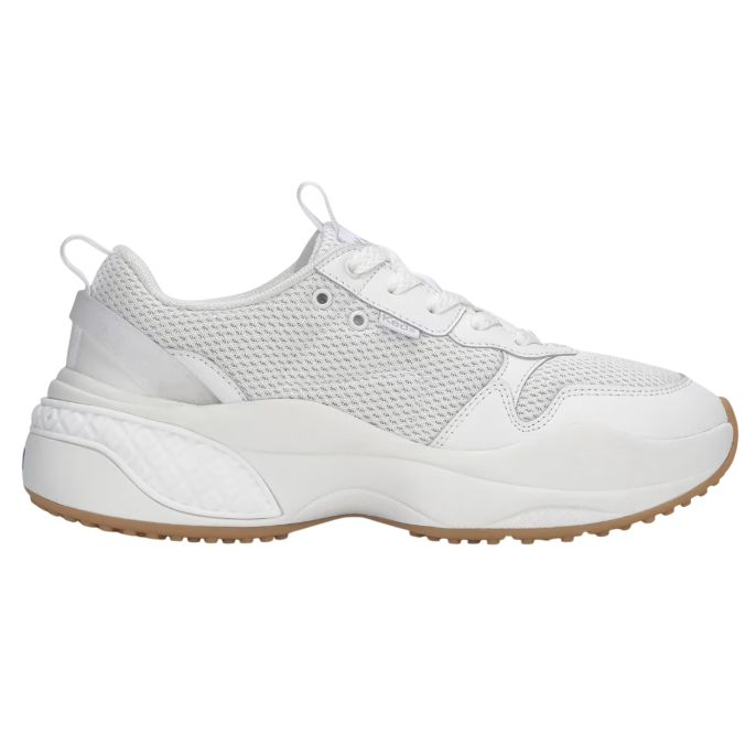 A white athletic sneaker features a mesh upper with leather overlays, a chunky sole with textured detailing, and a tan rubber outsole.
