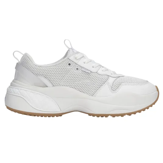 A white athletic sneaker features a mesh upper with leather overlays, a chunky sole with textured detailing, and a tan rubber outsole.