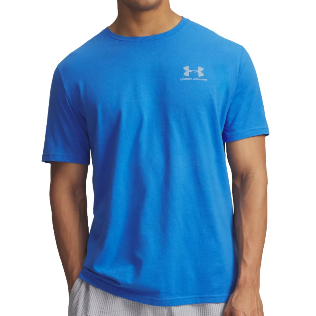 A blue Under Armour T-shirt with short sleeves and a small logo on the chest, paired with light-colored shorts.