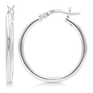 A pair of polished silver hoop earrings with a latch-back closure, featuring a smooth, shiny finish.