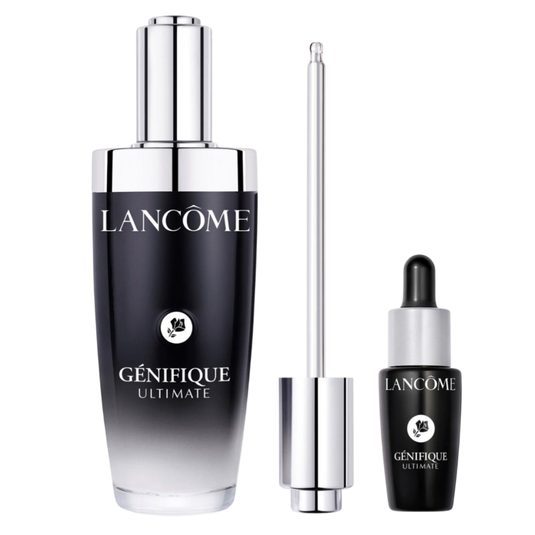 Lancôme Génifique Ultimate set includes a large serum bottle with a dropper and a smaller vial. The packaging is sleek with a black-to-clear gradient design.