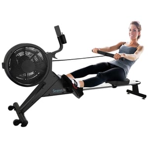 A SereneLife rowing machine with an air resistance system, featuring a sliding seat and foot straps. A woman is using the machine, demonstrating its ergonomic design for fitness training.