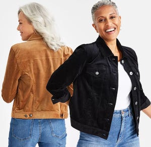 Two women smiling, wearing denim jackets in black and brown with classic collars and button fronts, paired with jeans.