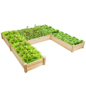 A wooden L-shaped raised garden bed with a variety of green vegetables and some flowering plants.