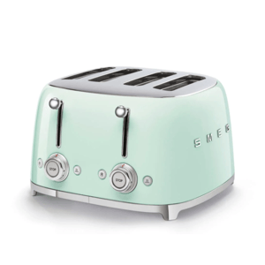 A mint green, retro-style SMEG four-slice toaster with dual controls and a chrome finish.
