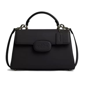 A black leather Coach purse featuring a top handle, adjustable shoulder strap, and the Coach New York logo on the front.