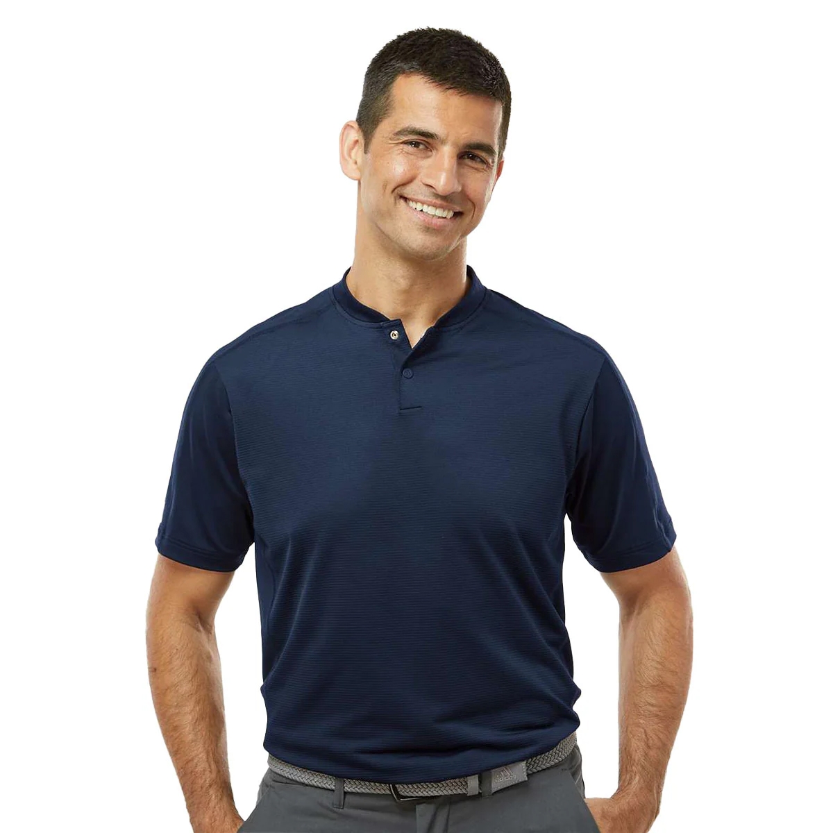 A man is wearing a dark navy short-sleeve henley shirt with a buttoned placket, paired with gray pants and a black woven belt.