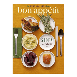 Bon Appétit Thanksgiving issue cover featuring side dishes: maple bacon cabbage wedges, green beans with Parmesan vinaigrette, mashed potatoes, glazed purple sweet potatoes, and golden brown dinner rolls alongside utensils on a mustard-yellow background.