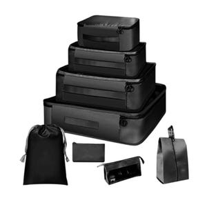 The 8-piece travel cube set includes four black packing cubes of varying sizes, a drawstring bag, a small pouch, a toiletry bag, and a hanging toiletry organizer.