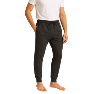 A person wearing black jogger pants with an elastic waistband and drawstring, paired with a white T-shirt.