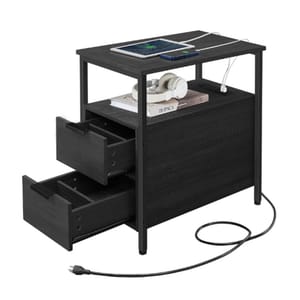 A black side table with two open drawers and a top shelf holding a tablet, phone, and headphones. It features built-in charging ports, with a visible power cord extending from the back.