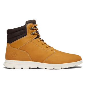 A yellow-brown Timberland boot with a white sole and brown padded collar.