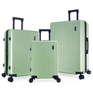 Three mint green hard-shell suitcases with black handles and wheels, varying in size.