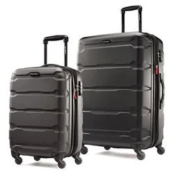 Two black hard-shell suitcases with telescopic handles and four spinner wheels each are displayed side by side, differing in size.