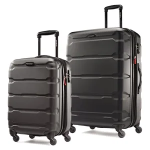 Two black hard-shell suitcases with telescopic handles and four spinner wheels each are displayed side by side, differing in size.