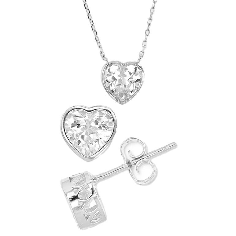 Heart-shaped crystal pendant necklace and matching stud earrings in silver-tone metal.