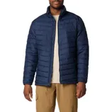 A man is wearing a navy blue, quilted insulated jacket with a full-zip front, stand-up collar, and side pockets.