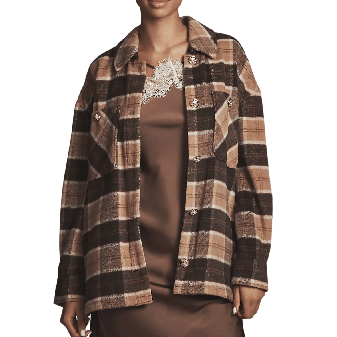 A plaid jacket in shades of brown and beige with gold buttons is worn over a brown dress featuring a lace neckline.