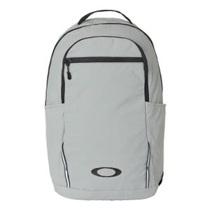 A light gray backpack with a front zippered pocket, side pockets, and a handle on top, featuring a black logo on the lower front.