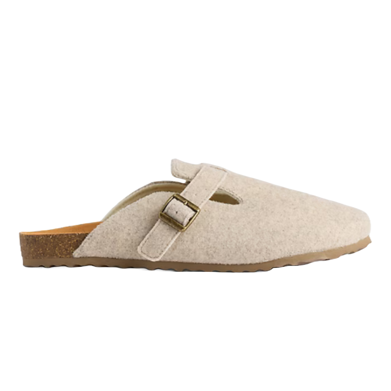 A beige slip-on clog with a felt upper, featuring an adjustable strap with a brass buckle and a cork sole for comfort and support.