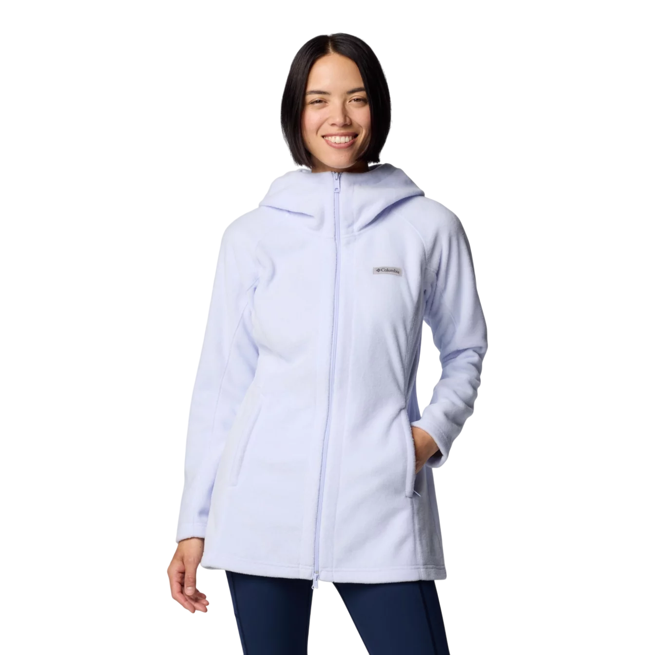 A woman is wearing a light blue Columbia fleece jacket with a hood, featuring a front zipper and hand pockets.
