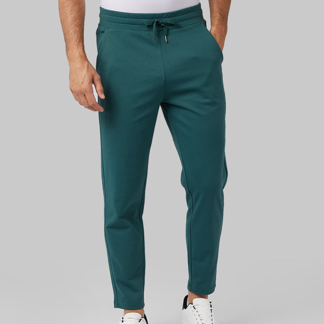 Men's teal jogger pants with a drawstring waist.