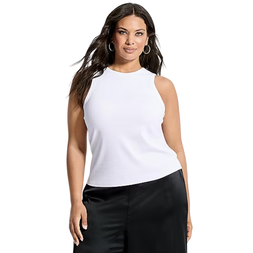 A woman wears a sleeveless white top and black pants, complemented by hoop earrings.