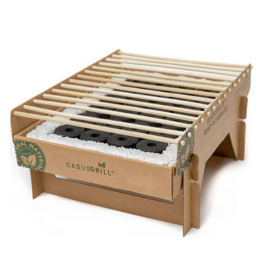 Biodegradable instant grills made from natural materials with bamboo grates and charcoal briquettes, designed for easy disposal and eco-friendly outdoor cooking.