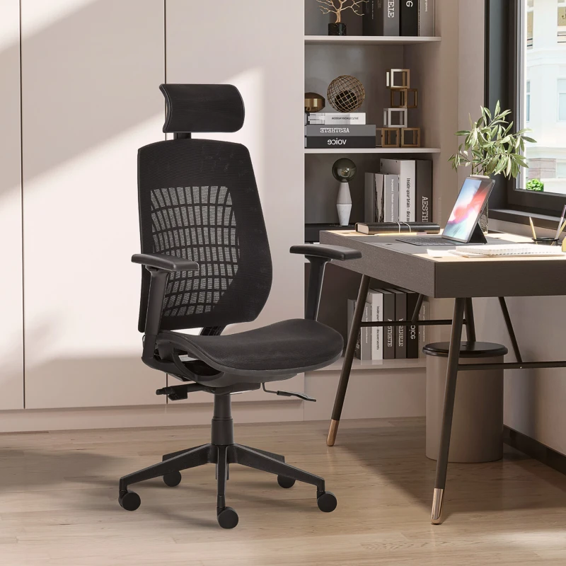 An ergonomic office chair with a mesh backrest and adjustable armrests, positioned in a modern workspace setting featuring a desk with a laptop, books, and decor items.