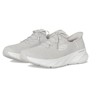 Skechers Hands Free Slip-In Shoes feature a sleek, light gray knit mesh upper with a lace-up design, a high-traction outsole, and a comfortable cushioned midsole for easy slip-on convenience and support.
