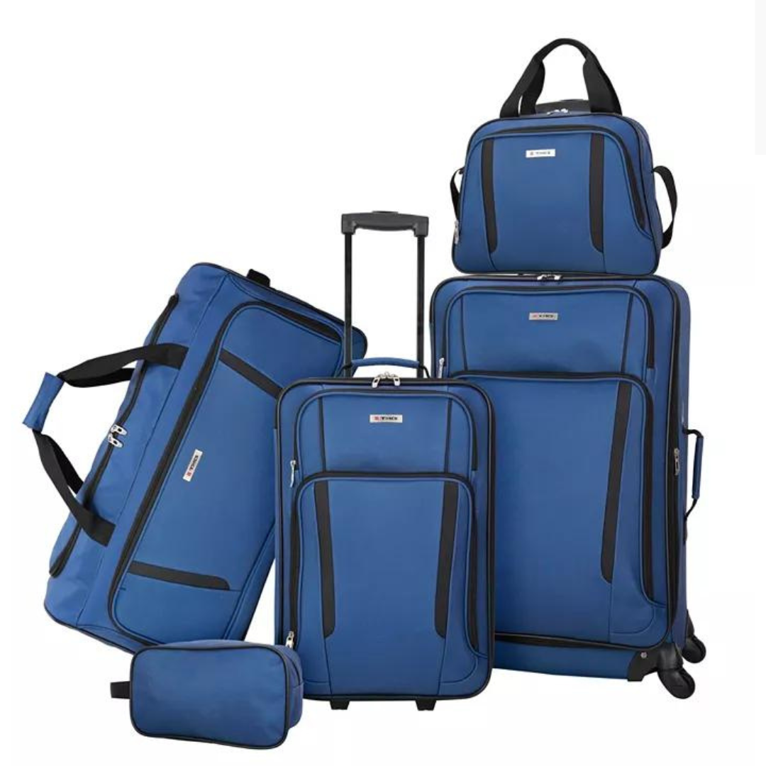 A set of blue luggage consisting of two rolling suitcases, a travel duffel, a backpack, and a toiletry bag.