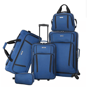 A set of blue luggage consisting of two rolling suitcases, a travel duffel, a backpack, and a toiletry bag.