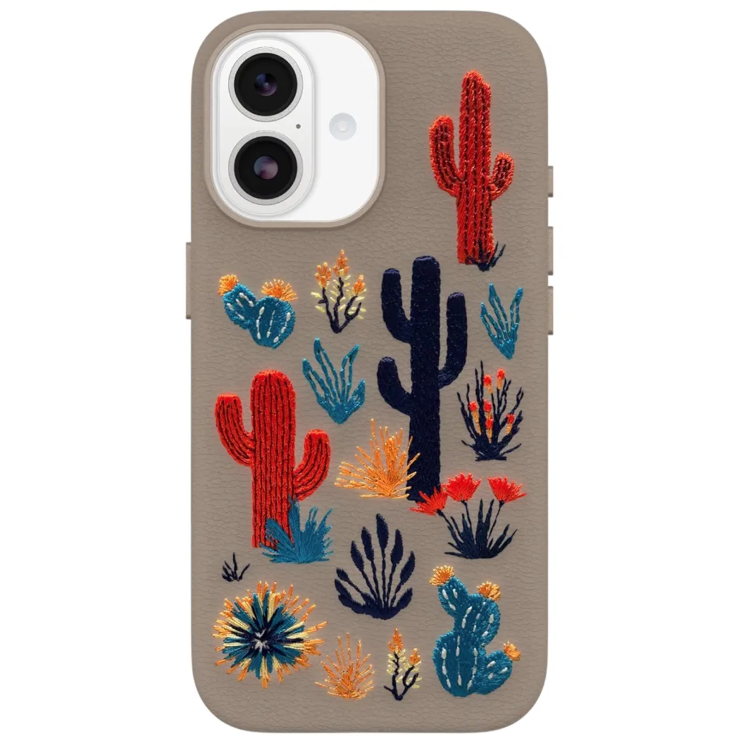 A phone case with embroidered cactus designs in red, blue, and orange tones on a beige background.