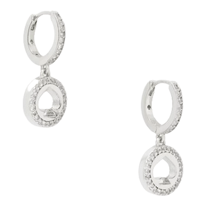 These are silver hoop earrings with a circle and spade-shaped design, embellished with small, sparkling stones. They are called \“Spot The Spade Pave Huggies\“ and have a modern, elegant appearance.