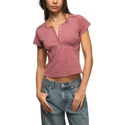 A person wearing a short-sleeve, button-up henley top in a dusty rose color paired with high-waisted blue jeans.