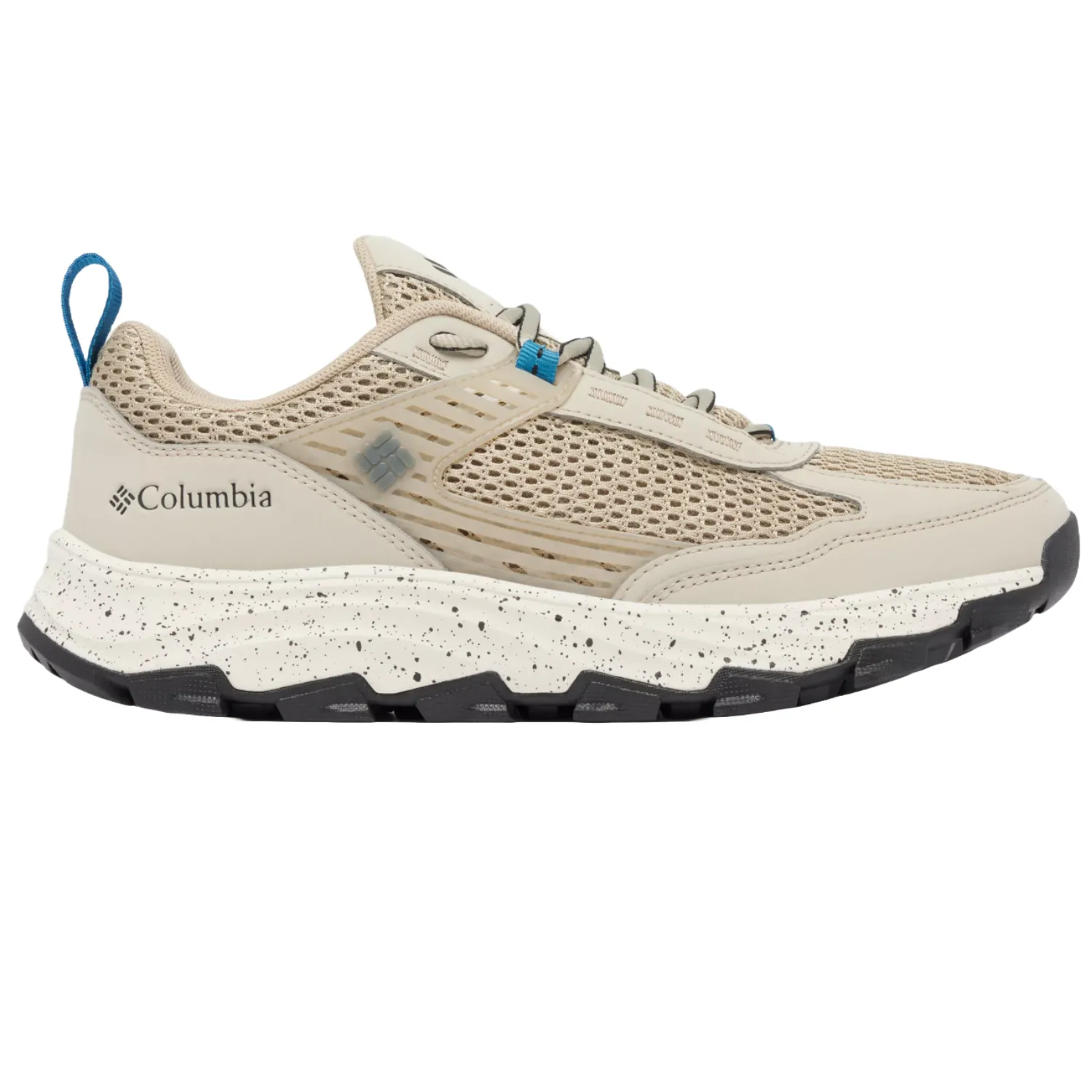 Columbia trail running shoe with a tan mesh upper, speckled midsole, and black outsole. Features a blue pull tab and the Columbia logo.